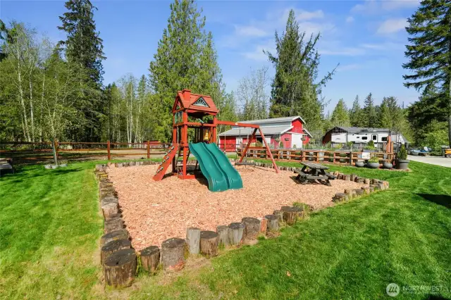 Backyard playground with cedar play set.