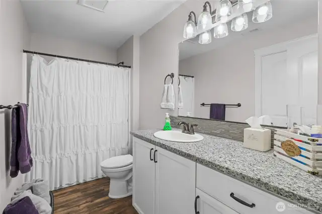 Upstairs full bath open to bedroom.