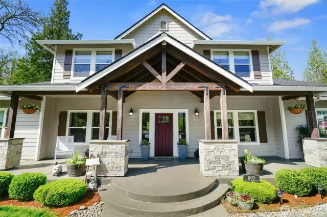 Front view with welcoming fronp porch.