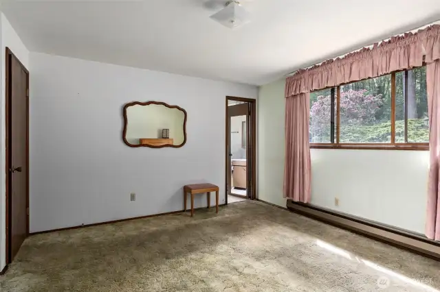Primary bedroom with views over back yard