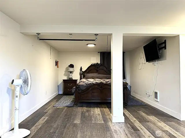Large room located downstairs currently being used as a 4th bedroom