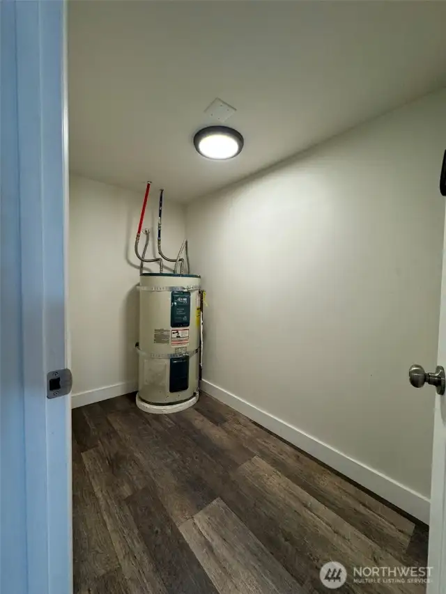 Large closet or storage room located downstairs in office.