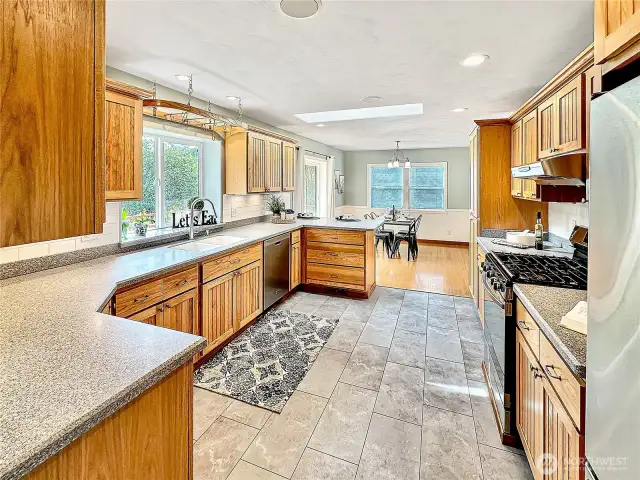In this photo you can see how spacious the kitchen is with room for several cooks and ample counter space for meal prep.