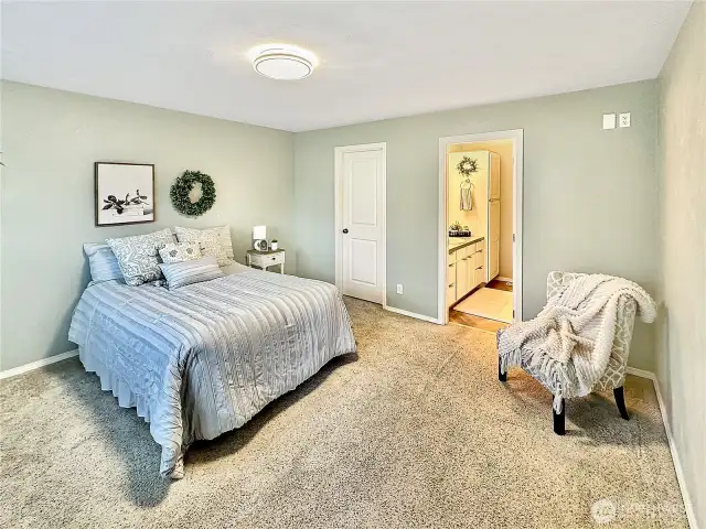 Primary bedroom with walk-in closet and private bath.