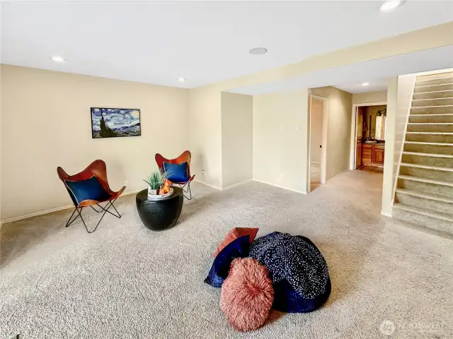 Spacious family room with slider that offers natural light and access to the rear patio and grounds.