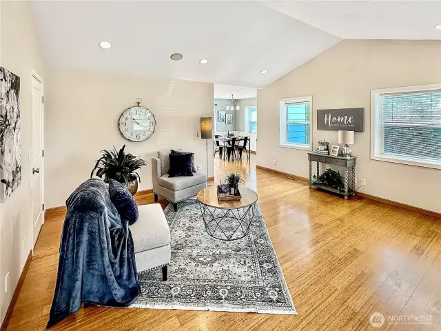 You will enjoy the vaulted living room with bamboo floor, corner gas fireplace and easy access to dining and kitchen areas.