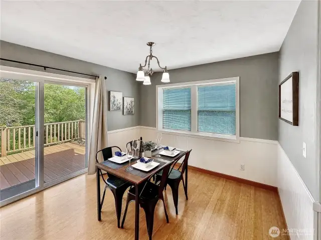 Light and airy dining room with access to both the rear sundeck and spacious kitchen.