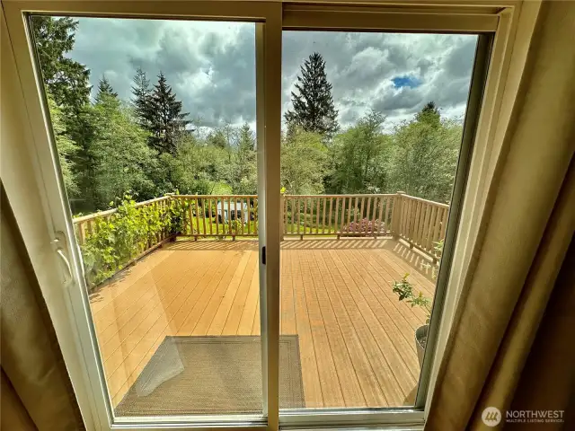 Side deck located just off the dining/kitchen area.  Perfect place to enjoy the afternoon sun.