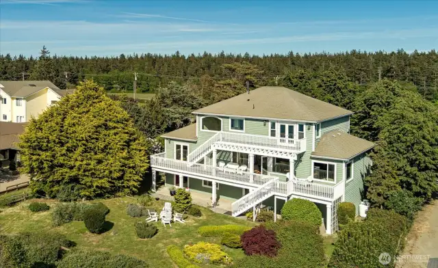 2029 West Beach Road in Oak Harbor. Custom-built and fully updated multilevel 3-story home with 3 bedrooms, 1 full bath, and two 3/4 baths, and 4,494 sqft of living space. The home is surrounded with tree-lined privacy, and situated on 98ft of high-bank waterfront. The scenic views are endless with the Olympic mountain range, the San Juan Islands and the straits of Puget Sound.