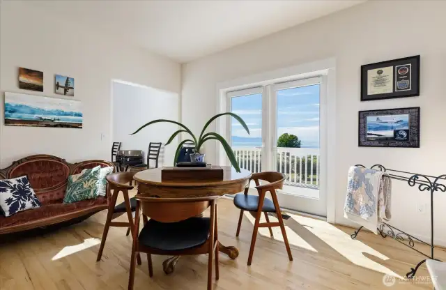 The formal Dining Room or additional sitting room area is located on the 2nd level with hickory wood floors and French doors out to one of the multi-level decks. Views of the water & mountains. Also access to the Living Room & Kitchen areas.