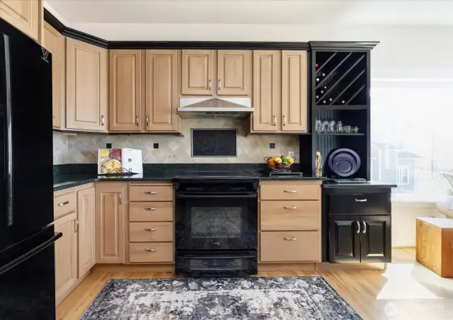 New black kitchen appliances (refrigerator, stove/oven & dishwasher) were installed in 2010. The stove/oven is fueled by propane gas, and has vented hood. Special wine storage area in the cabinets.
