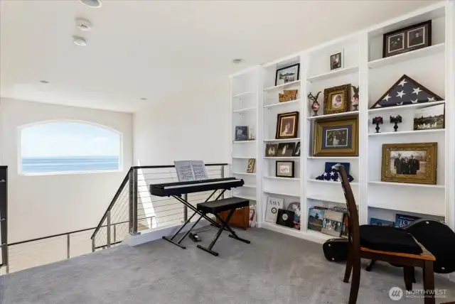 At the top of the stairs on the 3rd level is the entrance to Music area, and the Primary Ensuite.