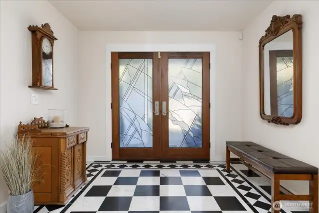 Home's front entry is highlighted by the beautifully-designed Marble floor, and the specially-designed lead-glass windowed front doors.