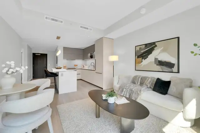 Modern living room and kitchen equipped with upscale kitchen appliances