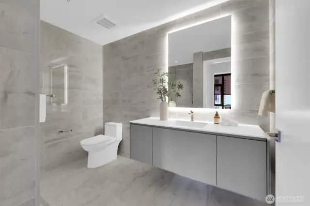 Modern contemporary bathroom with a fancy backlit mirror