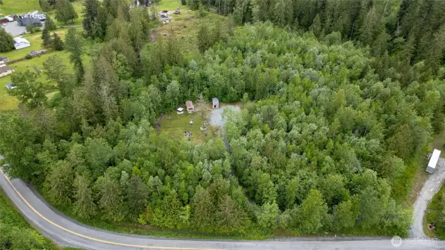 Aerial view of the property, with the building site already cleared and still maintaining privacy with the surrounding trees.