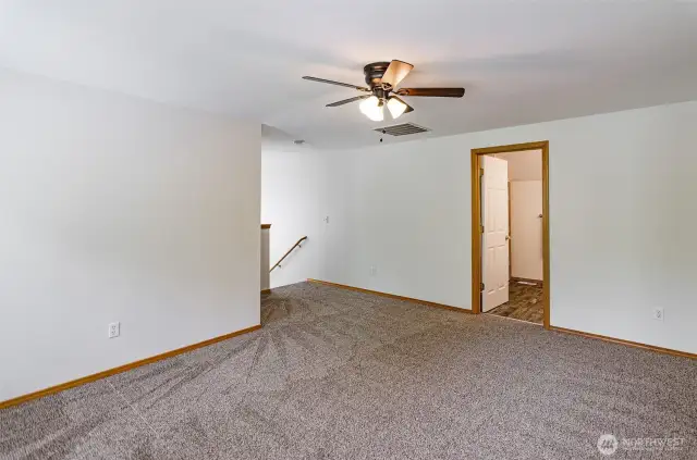 Another view. This shows stair access and access to full bathroom.  Brand new carpet on upper level and stairs.