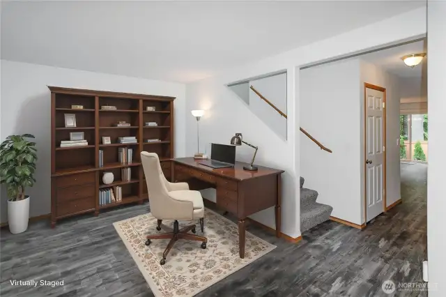 Luxury vinyl planked floor through main living areas.   Front room offers a space for home office or formal living room.