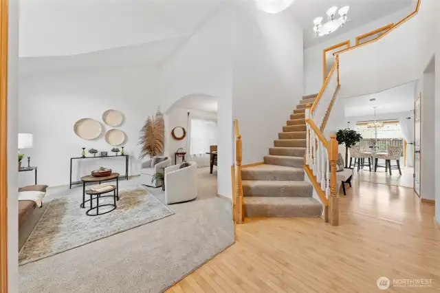 The grand entrance draws you in with spacious rooms, soaring ceilings, and lots of natural light.