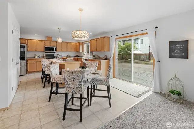 Take in the large kitchen, informal dining, and a peak at your large outdoor entertaining area.
