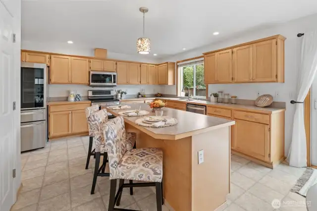 The kitchen is the heart of the home and this one will make it skip a beat. LOTS of counter space, LOTS of cabinets, soft-close drawers, S/S appliances, island to fit 4 people and a very spacious pantry.