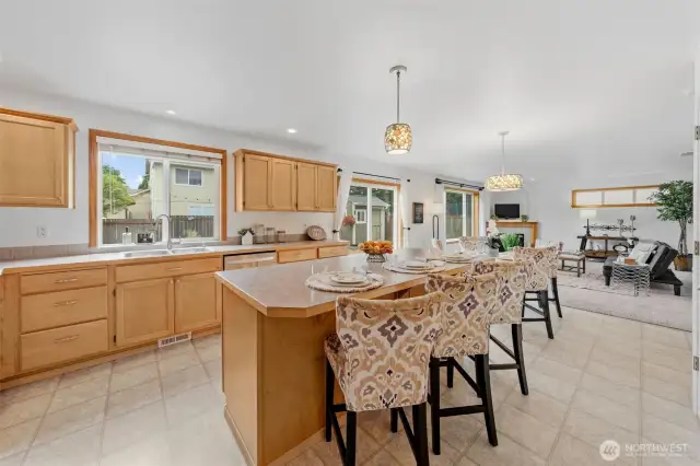 Kitchen window looks out to the expansive backyard and deck - perfect for outdoor entertaining.