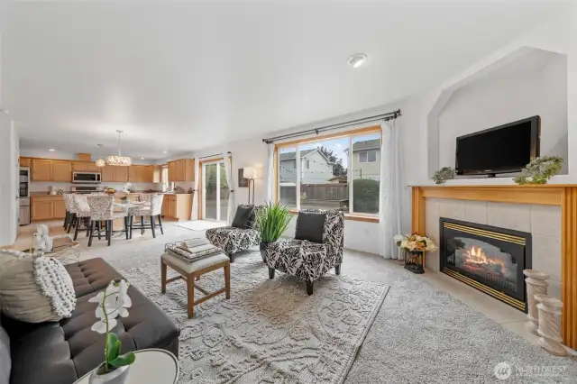 Gas fireplace w/fan system that helps spread all the warmth when needed and this area has a great view of the pretty backyard.