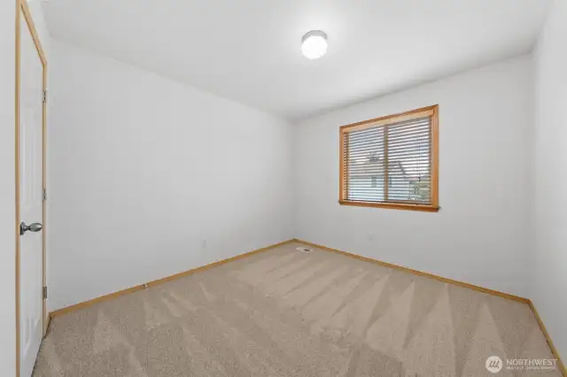 Bedroom #2. Window looks out to the backyard.