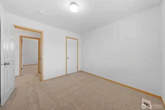 Bedroom #2. Another spacious bedroom room with closet door to the right.