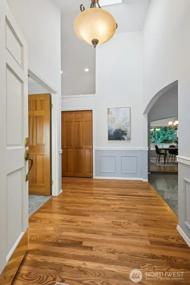 Opening the door, right away you can see the refinished hardwoods and wainscoting. There's a large Office/Den to the left and the formal living room to the right.