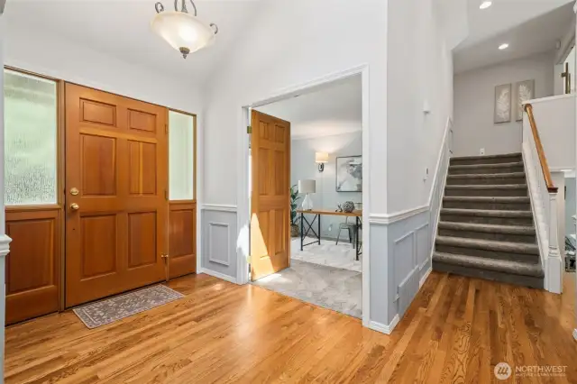 Here's a peek into the office with 6 panel wood double-door entry. Stairs to the right here take you upstairs to the bedrooms.