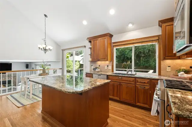 Another view shows you the eat-in kitchen area, window to the backyard, you can see the top to the gas range to the right here, and a microwave too.