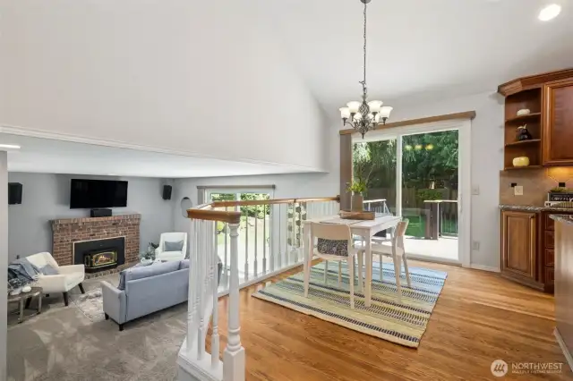 Here's a peek, just off the kitchen of the family room. It has a mounted TV, sound bar, speakers that come with the house. The slider in this photo takes you out to the newer composite deck, and access to the backyard.
