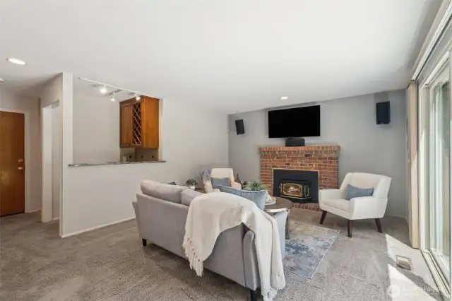 Additional view of the family room, with the dry bar to the left.