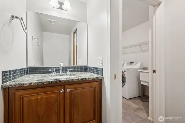 There's a convenient powder room just off the family room, and the laundry room/sink is shown just outside.