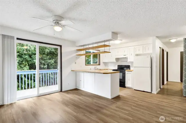 Dining. 6' sliding glass door. East.  Forest views.