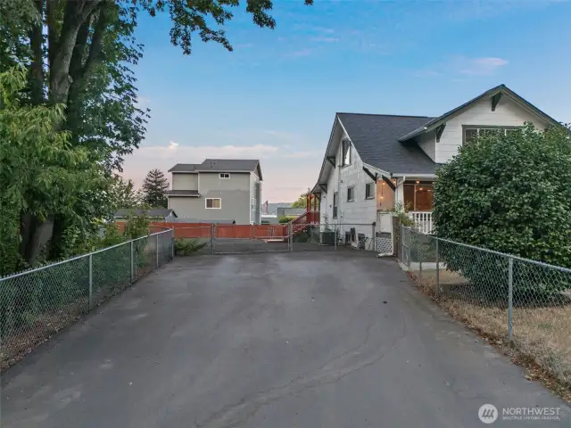 Second Driveway to large gravel parking area. Put a shop back here?