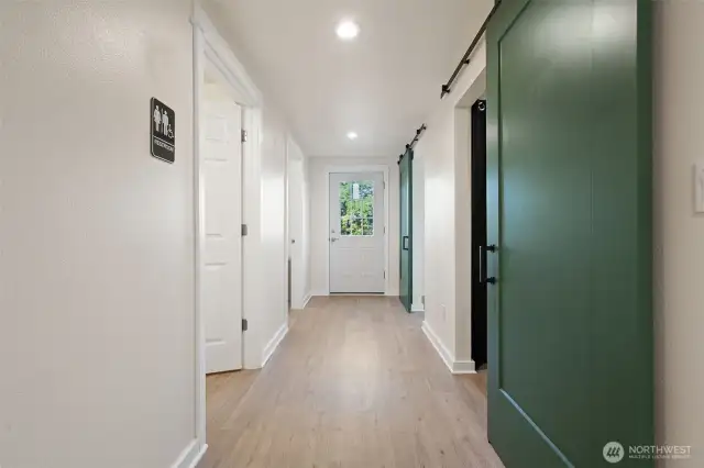 Salon back hallway with / bath, kitchen area and 2 massage rooms