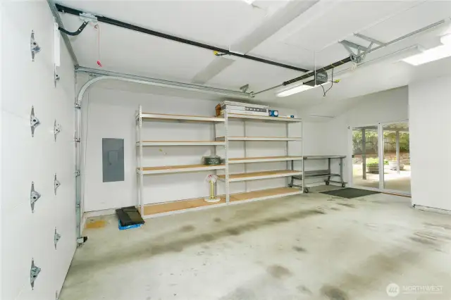 shop space in garage with doors to backyard