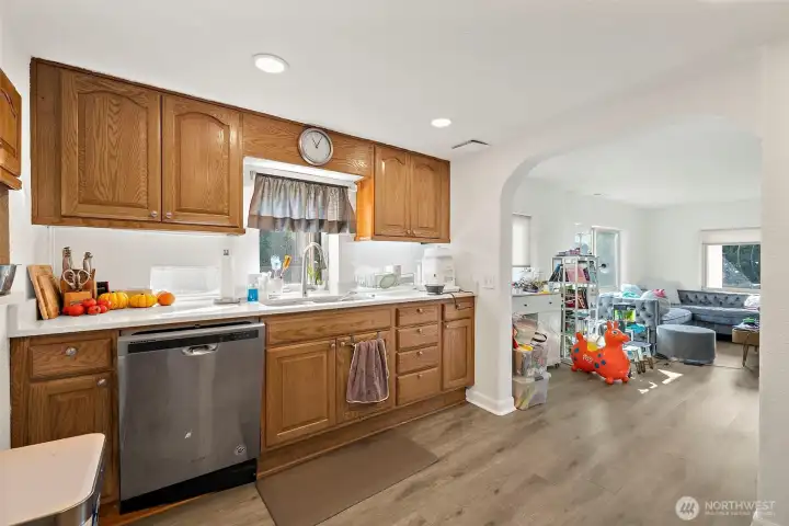 Kitchen with stainless steel dishwasher.