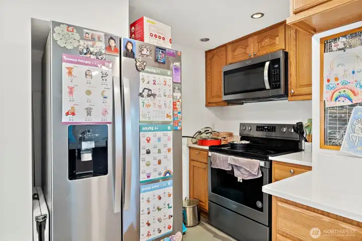 Hot water tank is located behind fridge. Located beneath the stairs.