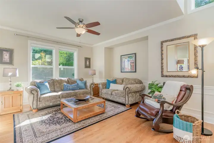 Formal living room includes a gas fireplace.