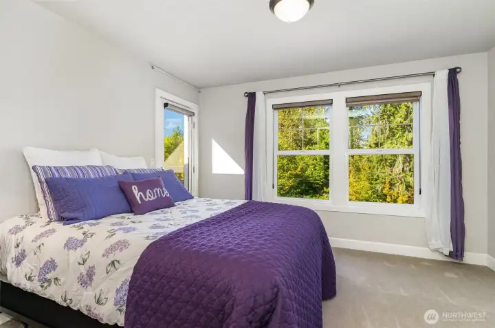 This bedroom features a deck & en-suite bathroom.