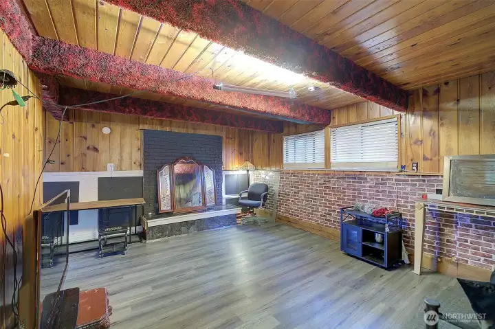 The family room with its own fireplace. The 3rd one in the home.