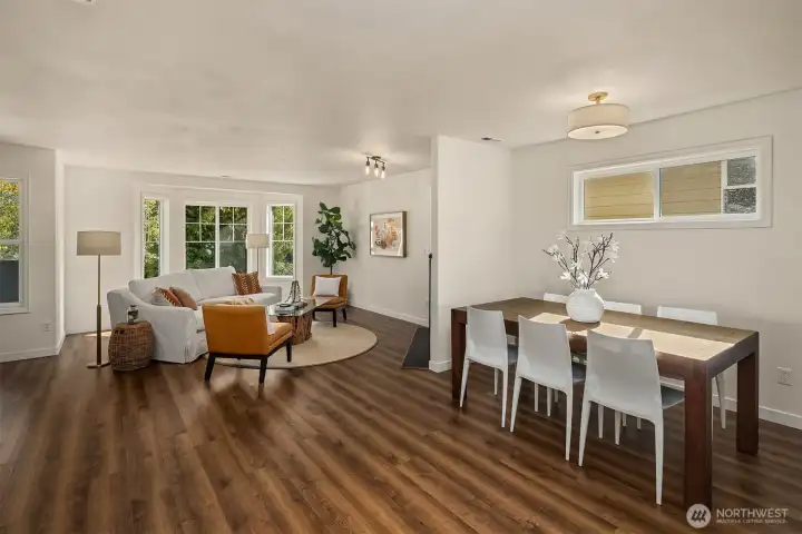 New LVP flooring throughout the home. Dining area large enough to comfortably fit an 8 person dining table.