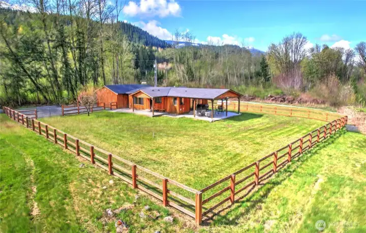 Fully fenced yard and partially fenced property