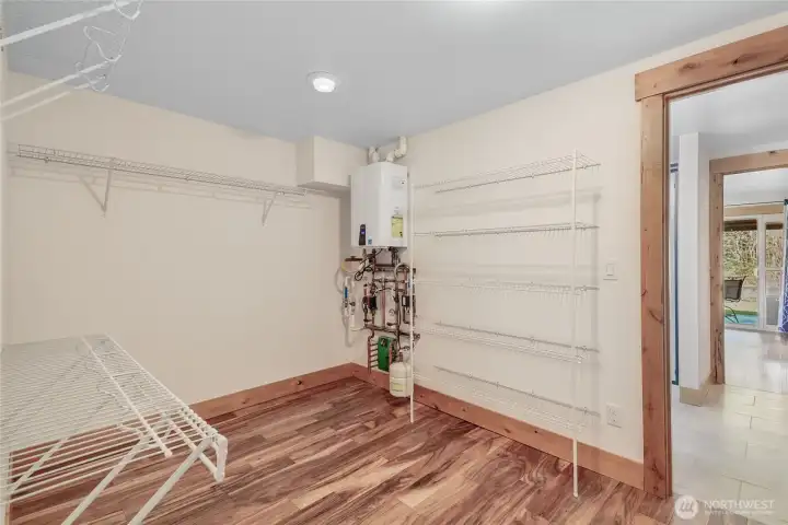 Huge closet with tankless water he  ater