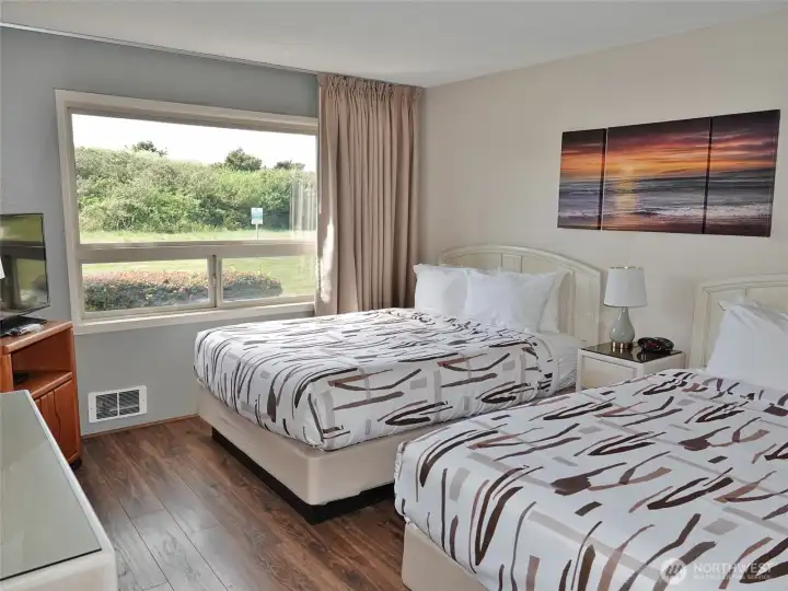 Main Bedroom w/ 2 Queen beds and views of the Dunes and the hotel's backyard.