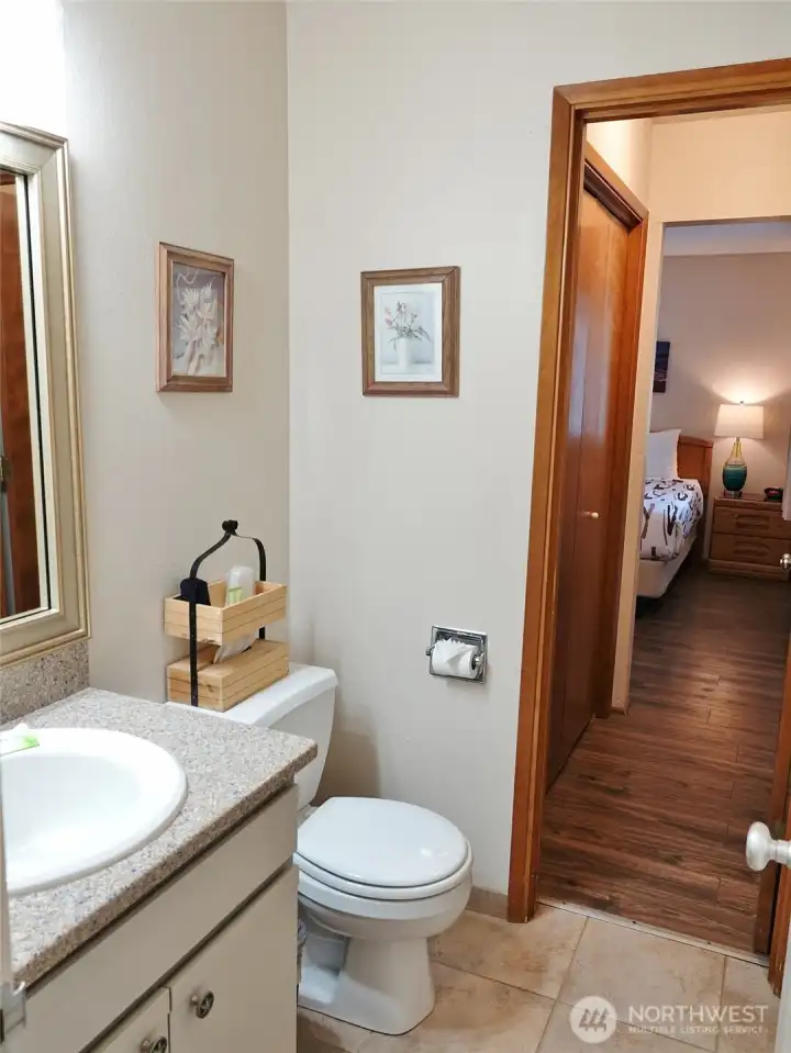 1/2-Bathroom, which leads into the 2nd Bedroom.