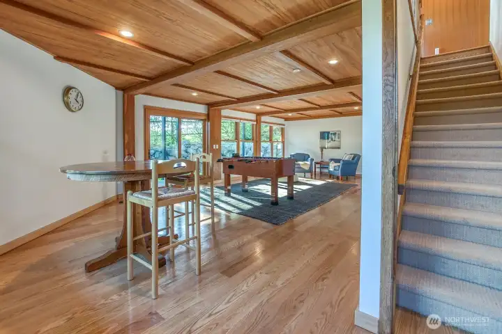 Spacious downstairs Family room and bedroom suite with entrances to the patios and gardens.
